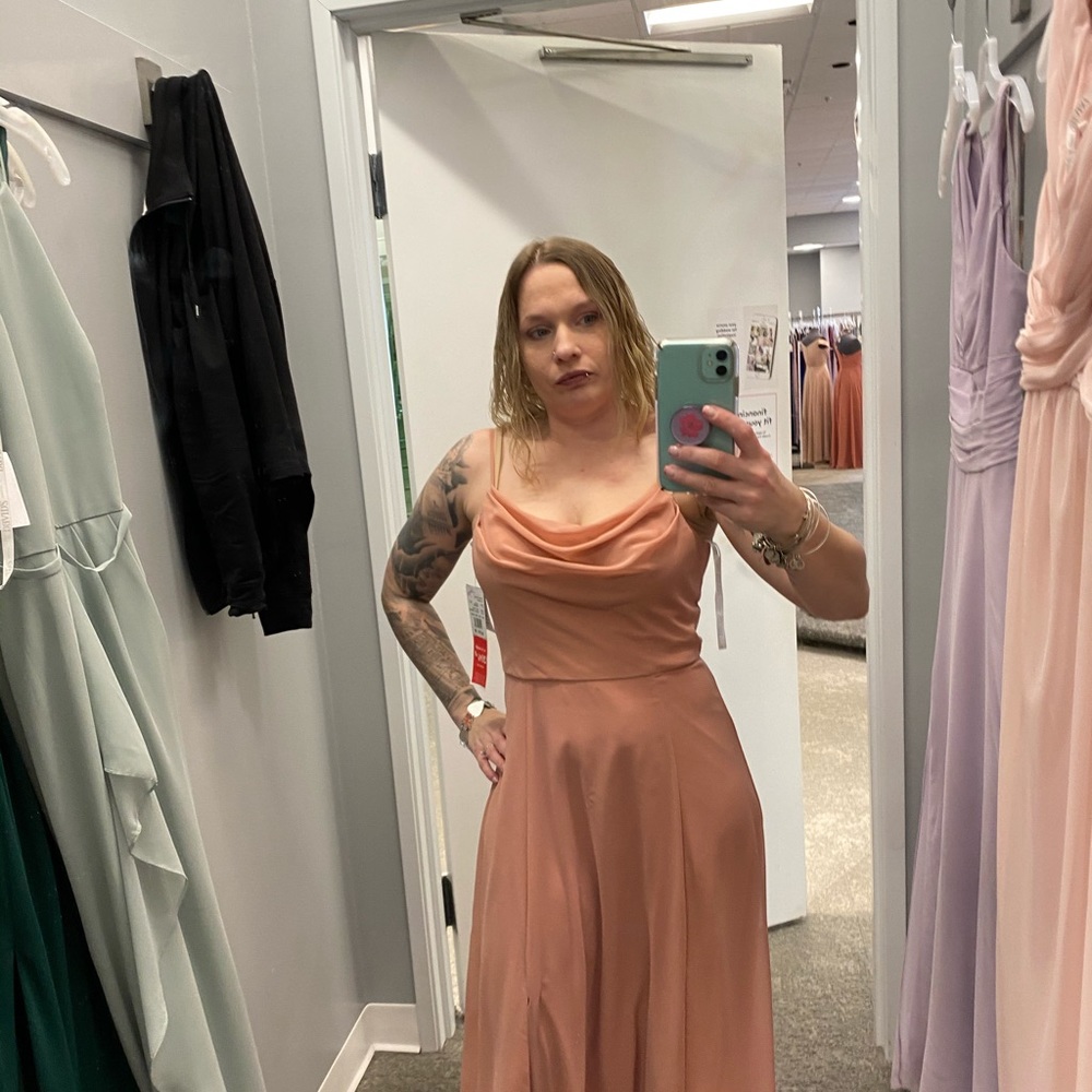NWT David’s Bridal bridesmaids or prom dress. Still has bag over it. Never worn.